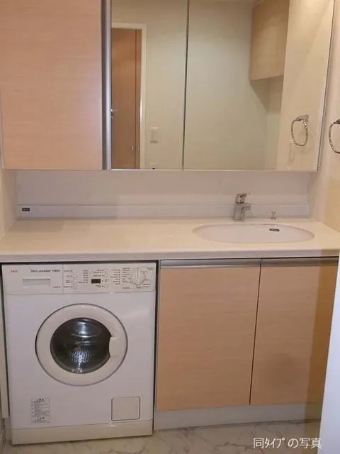 New City Apartments Shiba Park - Interior - ["Cabinetry", "Washing machine", "Tap"]