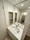 Residia Tsukishima II - Interior - ["Mirror", "Tap", "Bathroom sink"] thumbnail
