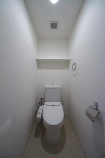 Unison Tower - Interior - ["Toilet seat", "Toilet", "Plumbing fixture"]